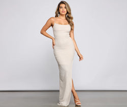 Turn heads at Prom 2025 in this ivory prom dress, where statement-making details meet the iconic style of the Lola Formal High Slit Glitzy Glitter Dress .