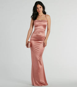 Turn heads at Prom 2025 in this rose gold prom dress, where statement-making details meet the iconic style of the Courteney Cowl Neck Mermaid Satin Formal Dress .