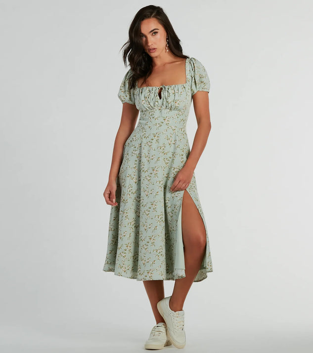 Essential for vacations or summer days, the RSVP To Cute Ditsy Wildflower Tie A-Line Midi Dress is a sundress or milkmaid dress with sleek and flirty details.