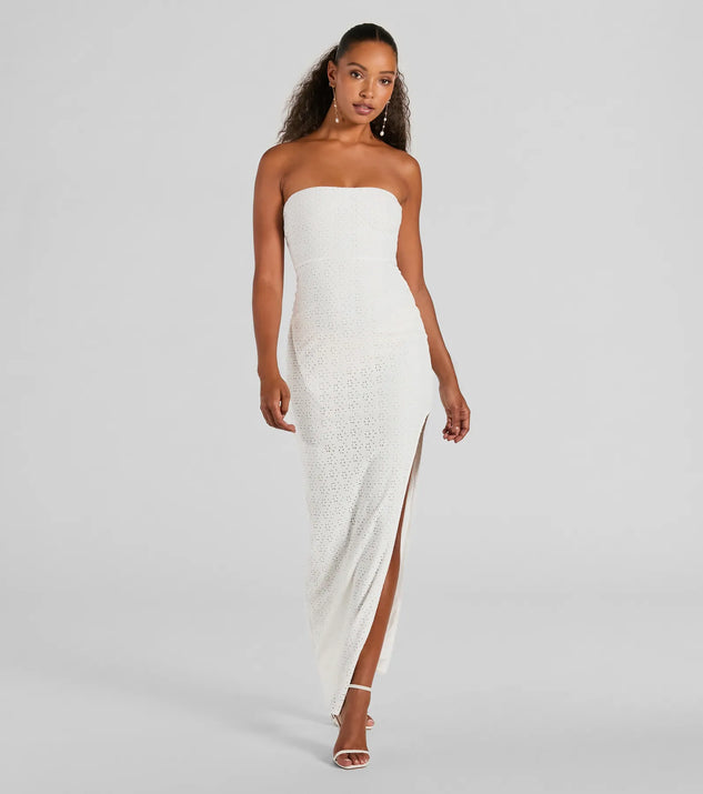 Essential for vacations or summer days, the Tuscan Charm Strapless Slit Eyelet Maxi Dress is a sundress or milkmaid dress with sleek and flirty details.