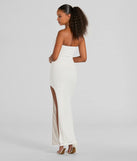 Essential for vacations or summer days, the Tuscan Charm Strapless Slit Eyelet Maxi Dress is a sundress or milkmaid dress with sleek and flirty details.