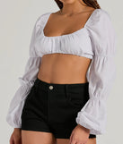 The Official Cutie Tie Back Long Sleeve Crop Top is a women's long-sleeve top with an elevated style and unique design accents, perfect for layering or transitioning into colder months.